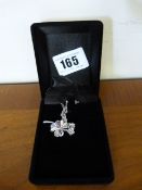 Ladies Silver Coloured Pendant of a Flower with a Pink Stone