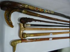 Collection of Walking Sticks including A Silver Topped Walking Stick
