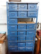 Blue Steel Rack Containing Assorted Metal Trays