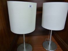 *Pair of Brushed Stainless Steel Lamps with Cream Shades