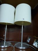 *Pair of Brushed Stainless Steel Lamps with Cream Shades