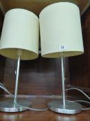 *Pair of Brushed Stainless Steel Lamps with Cream Shades