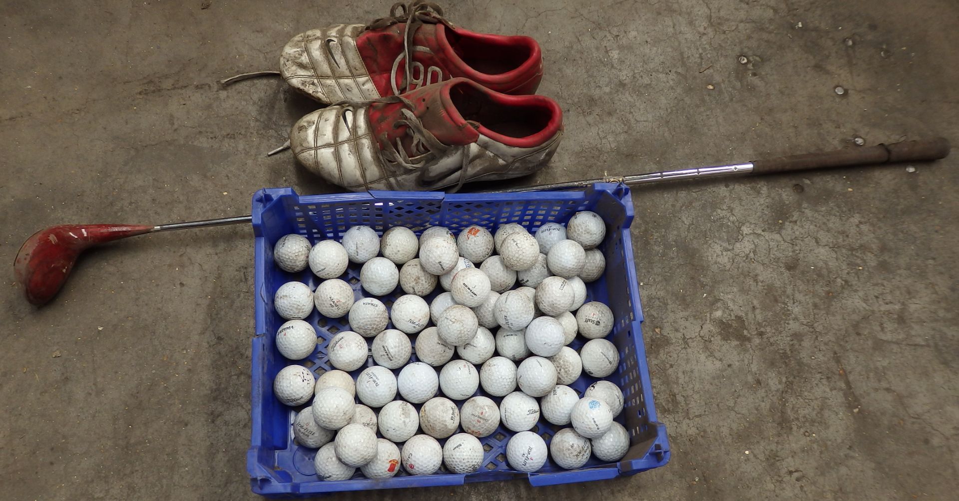 1 x Assorted Collection of Sports Equipment Including 2 x Golf Clubs, Golf Balls and Nike Total