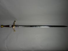 A Wilkinson commemorative sword in the Celtic style with decorative blade and polished wooden