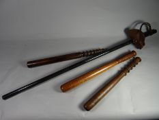 A long mounted police truncheon together with three others
