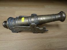A small brass Dutch Poop deck cannon, 30 cms in length