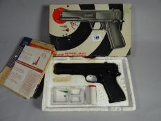 A boxed .177 Diana air pistol complete with paper instructions and targets