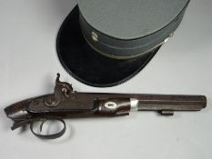 A percussion pistol marked Southall with missing stock, decorative foliate engraving, pineapple