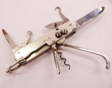 A quality Victorian hallmarked silver combination knife with 9 different functions, measuring 8