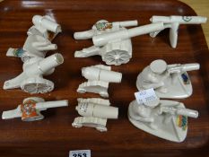 Eleven crested china machine guns and artillery pieces