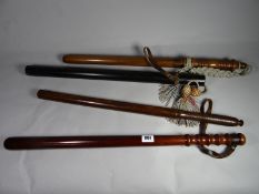 An American police parade truncheon together with three other truncheons