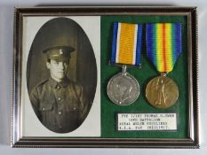 A framed WWI pair of War & Victory Medals to 37787 Pte. Thomas O. Owen, 10th Bn. R.W.F. together