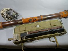 A French range finding measurement device marked 'Modele 1912'. together with a modern military
