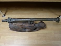 A brass Lantaka cannon on South East Asian sculpted wooden monkey mount, (61 cms) in length