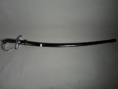 A German Democratic Republic sword with scabbard and insignia on crossguard