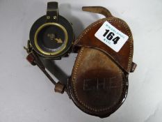 A leather cased WWI compass made by Hobson & Sons London 1914 and marked 'E.H. Evans'