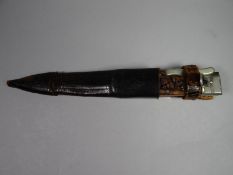 A heavy quality folding hunting knife with stag horn grip and white metal mounts and shaped blade
