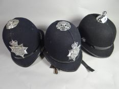 Two South Wales Constabulary police helmets and one other with no badge