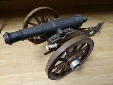A nineteenth century British signal cannon mounted on a modern oak carriage, (45 cms) in length