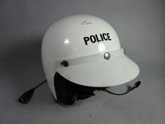 A retro open-faced police motorcycle helmet