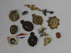A parcel of mainly military and civil badges and insignia etc.