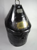 A painted black metal helmet box by Hamburger Rogers & Co., King St. Covent Garden with brass