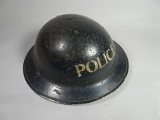 A 1938 dated blue police helmet complete with liner and chin strap