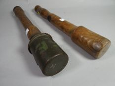 A German Third Reich stick hand grenade stamped 'RR513 1940' on both head and shaft, eagle mark on