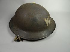 A WWII British Warden's helmet marked 'Vero I 1938' complete with liner and chinstrap
