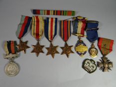 A grouping of eight medals and medallions to include WWII 1939-45, Africa, Burma and France &