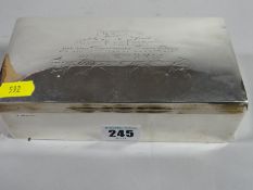 A hallmarked silver cigarette case inscribed on slightly damamged lid 'Presented to Capt. F. Le