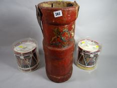 A Victorian red leather shell case with coat of arms and leather strap handle together with two