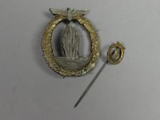A Kriegsmarine Minesweeper Breast Badge together with corresponding stick pin badge, awarded to