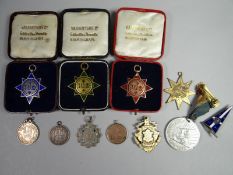 Eleven assorted medallions, some in boxes of issue and hallmarked silver and gold