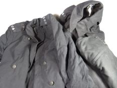 Two Newport Borough Police great coats together with a pair of police trousers