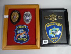 Two framed US Police metal and cloth badge sets to the Niagra County and Missouri State