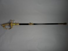 A U.S. Coast Guard's sword by Cark Eikhorn Solingen with elaborate foliate crossguard and blade