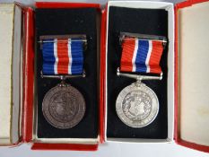 A Liverpool Police pair of silver and bronze medals with top ribbon bars in boxes of issue,