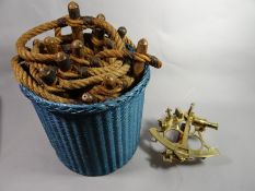 A brass naval sextant together with a maritime wooden rope ladder