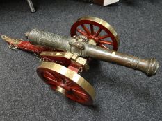 An eighteenth century bronze-barrelled Poop deck Spanish cannon with royal crown crest on a