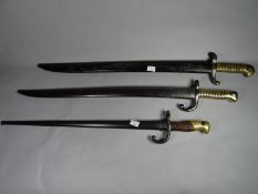 A French 1842 pattern bayonet together with a French Lebel bayonet with matching numbers and another