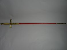 A Wilkinson Masonic sword with etched blade of various motifs, cruciform hilt and red leather and