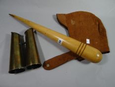 A marine rope-making wooden fid together with a nautical or aviation lined leather cap and brass