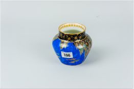 A Carltonware deep blue ground pottery bowl with 'Fairyland' style cascade pattern, impressed