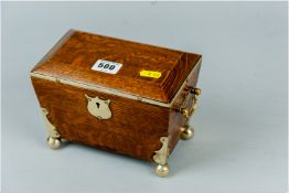 A late Victorian/early Edwardian oak tea caddy with brass pierced side handles, EP metal edge to the