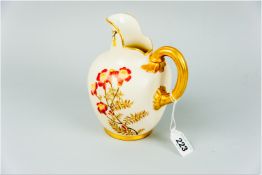A Royal Worcester pinched jug, blush ground decorated with painted and gilt highlighted flowers,