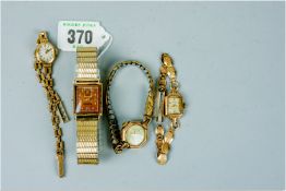 A parcel of three lady's nine carat gold encased wristwatches and a gent's yellow metal encased