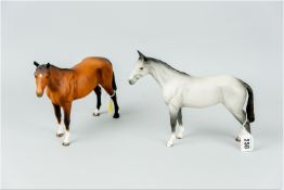 Two Beswick pottery horses, one of a chestnut colour and the other dappled grey, approximately 8 x