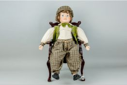 A reproduction mahogany Chippendale style open child's armchair, 20.5 ins (52 cms) high along with a