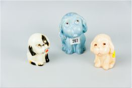 Three various coloured Crown Devon puppies, one blue, 5 ins (12.5 cms), one fawn, 4 ins (10 cms) and